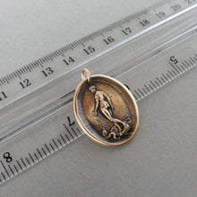 Load image into Gallery viewer, Wax seal pendant depicting Venus, goddess of love, standing on a shell drawn by a team of dolphins. Antique wax seal charm jewelry made in solid bronze.