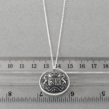 Load image into Gallery viewer, Wax seal necklace with unicorns, birds, stars, and Latin motto with promise of time. Antique wax seal charm jewelry crest made in silver.

