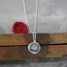 Load image into Gallery viewer, Silver necklace with a heart pendant on a wooden ruler
